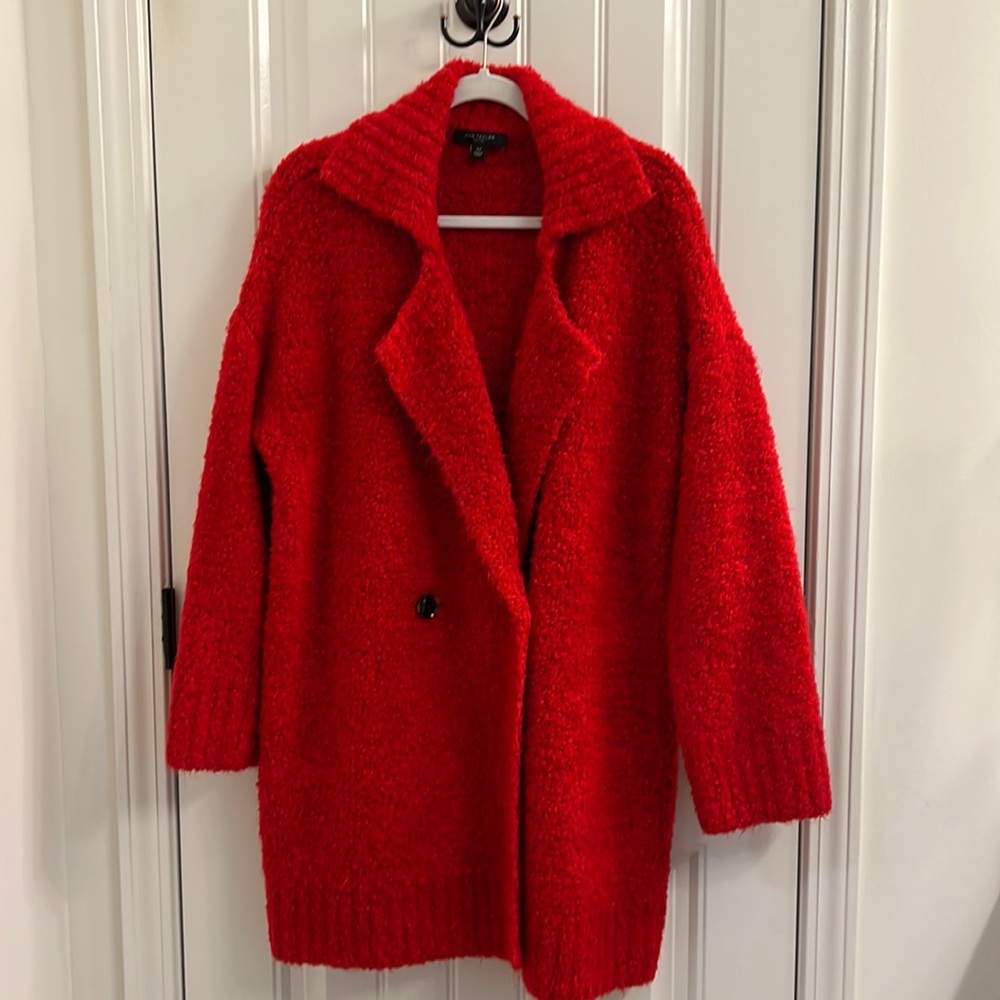 Ann Taylor Red Coat in Petite that has never been worn in size XLP.  Very soft!